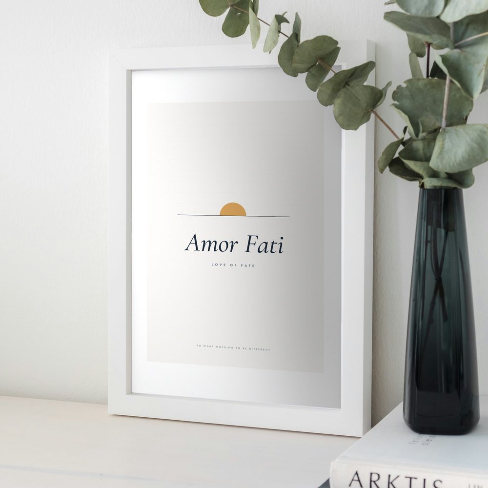 Amor Fati print framed in a room